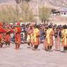 Atsara and folk dancers from the royal troupe, dance arena, Paro Tshechu (tshes bcu), 2nd day