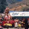 Dance of the Raksha (Raksha mang 'cham): Puppet ofYama Dharmaraja (gShin rje chos rgyal) going out helped by monks, the white god, the raksha, Paro Tshechu (tshe bcu), 4th day