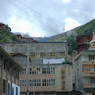 Modern Tibetan houses in Derge with stupa on roof.&nbsp;
