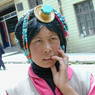 Tibetan woman with turquoise hair ornament.