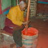 A worker making ink.