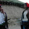 Two Khampa men with red hair tassles.