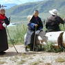 Old Tibetan women on hillside of the monastery.