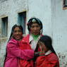 Tibetan women with turquoise hair ornaments and girl.