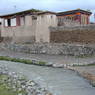 Tibetan houses made of earthen walls and logs.