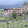Tibetan houses made of earthen walls and logs.