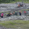 Tibetans gathering rocks for construction.
