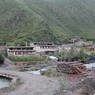 A small settlement of Tibetan houses made of stones and logs.