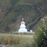 A large white stupa on the outskirts of Tawu.