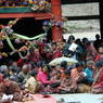 Monks, nuns, and laypeople gathered in the inner courtyard of the Assembly Hall ['du khang] for the morning teachings.