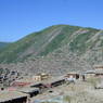 A view of the hillside containing the Nunnery at Larung Gar [bla rung gar] with its new Assembly Hall under construction in the foreground.