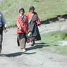 Local laypeople walking on hillside at Larung Gar [bla rung gar] containing the Nunnery.