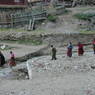 People walking to the Assembly Hall of the Lay Religious Center at Larung Gar [bla rung gar].