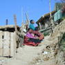 A Tibetan family resting and praying.