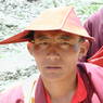 Tseko [tshe kho], the construction and road manager of Larung Gar [bla rung gar] religious settlement, and a typical monastic hat.