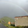 A rainbow over a house near the orphanage.