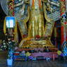 Offerings at the base of the status of 1000-armed, 1000-eyed Avalokitesvara.