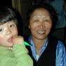 A Tibetan grandmother and grandchild.