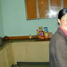 A Tibetan woman in the kitchen.