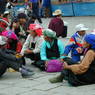Tibetan women gathered in the plaza in front of the Jokhang Temple.