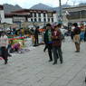 Tibetans going about their business in the plaza in front of the Jokhang Temple.