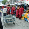 Monks talking with merchants in the plaza in front of the Jokhang Temple.