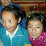 Two young Tibetan pilgrims inside the temple.