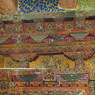 Close-up of an intricately carved and painted door frame.
