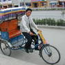 A rickshaw driver on the street in the Karma Kunzang neighborhood of eastern Lhasa.