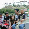 A Tibetan family taking a break by the pond.