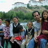 A Tibetan family taking a break by the pond.