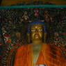 A large statue of Shakyamuni Buddha in the Tri Tsangkhang Chapel.