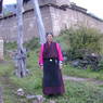 The second wife of Tsopo Dorlo Rinpoché, standing outside the monastery.