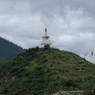 A view of a stupa on a nearby hilltop.