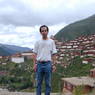David Germano with the monastery in the background.