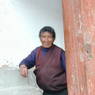 An elderly Tibetan woman visiting the monastery.