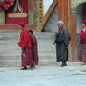 Nuns and a lay woman circumambulating the monastery.