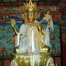 A statue of Avalokitesvara adorned with silk scarves on the second floor of the Zangdok Pelri Temple.