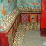 Statues of Padmasambhava along the wall on the second floor of the Zangdok Pelri Temple.