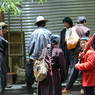 Tibetans talking on the street.