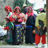 Nomad women and children waiting for the religious dances to begin.