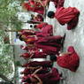 Monks debating religious topics in the debate courtyard.