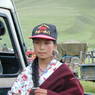A 14 year old Tibetan girl wearing a baseball cap.