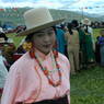 A dancer with a peach colored shirt waiting to perform.
