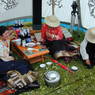 Three Tibetan women relaxing in a picnic tent.