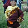 A young Tibetan boy wearing a fancy chuba.