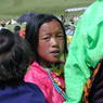 A young Tibetan girl in the crowd.