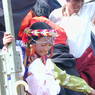 A young Tibetan girl wearing elaborate jewelry.