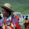 A Tibetan woman wearing a floral patterned shirt.