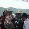 A group of Tibetans watching a spectacle.
